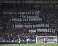Lyon fans protest against the owner, John Textor, at a match against Angers in May.
